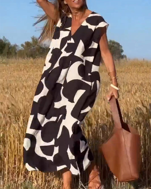 Vestido estampado con escote en V y corte fluido – STEPHARA