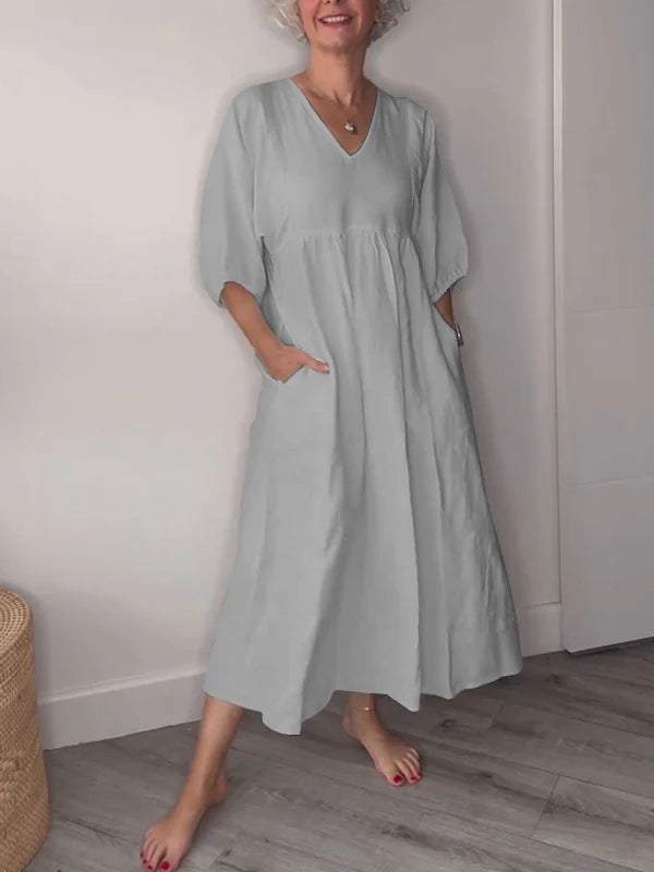Vestido midi con escote en V, bolsillos y corte fluido – LUCIE