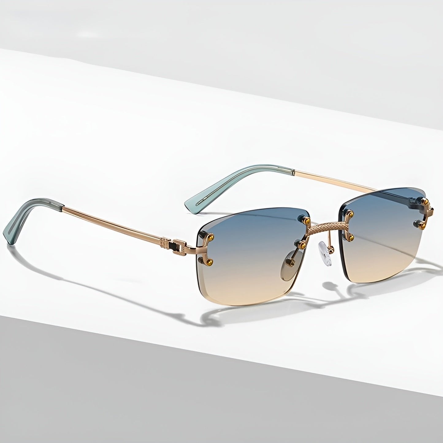 MAXIMO – Gafas de sol sin montura con varillas metálicas doradas y lentes degradados con protección UV400