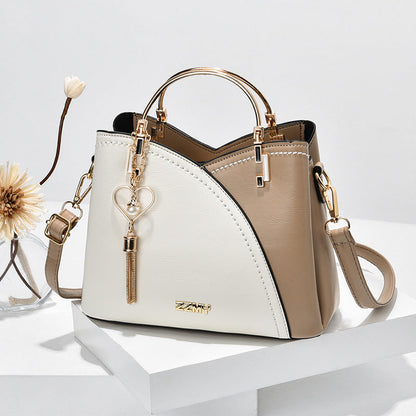 Bolso de mano lujoso con acabado elegante y correa ajustable – LOREVIA