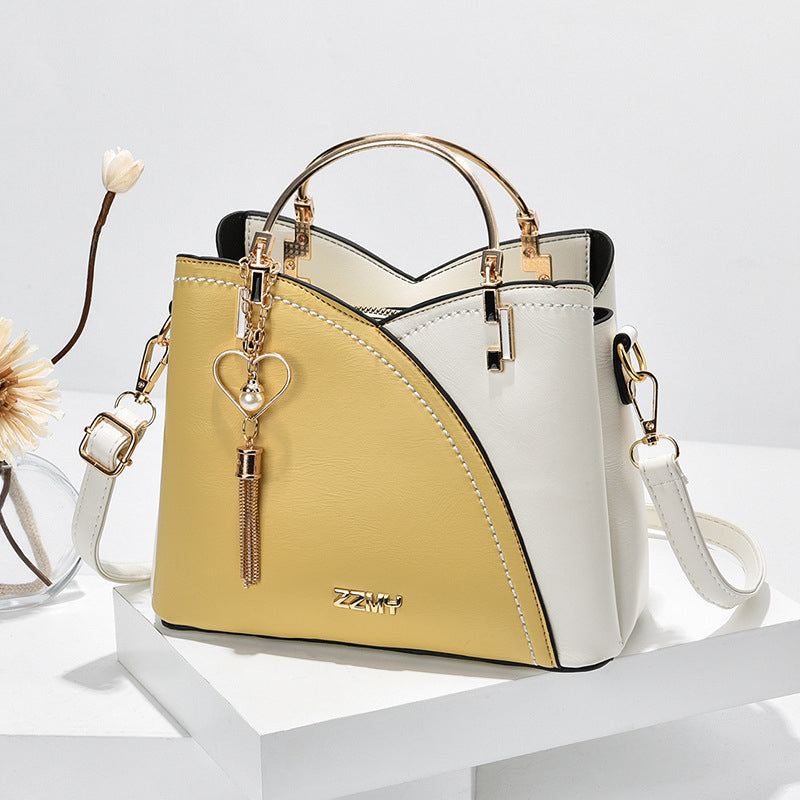 Bolso de mano lujoso con acabado elegante y correa ajustable – LOREVIA